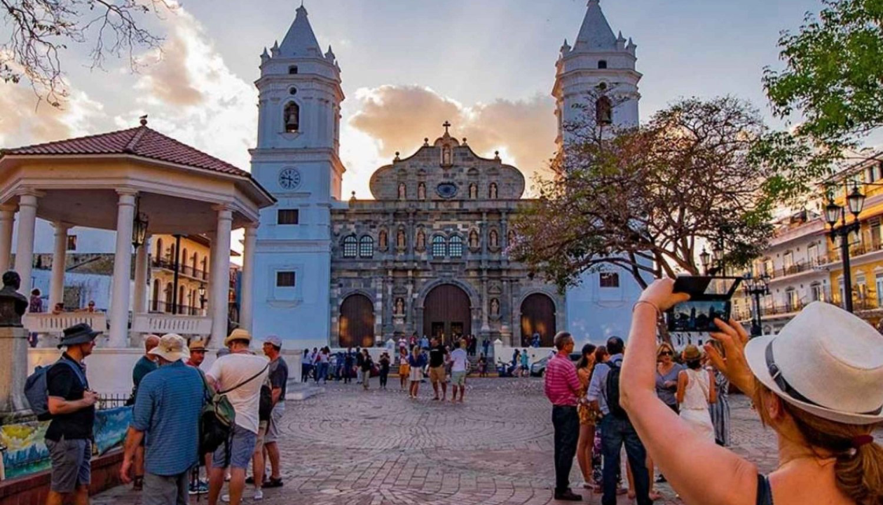 Woman taking a picture of cathedral in Casco Viejo on walking tour