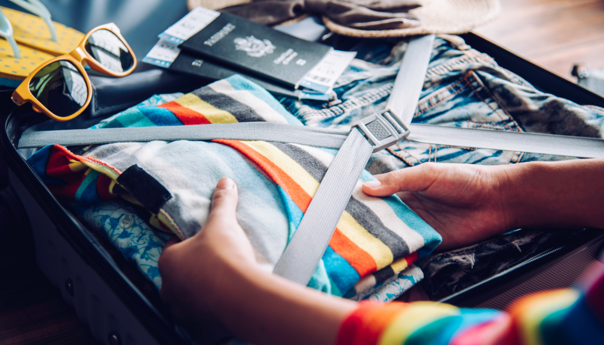 Traveler Packing a Luggage